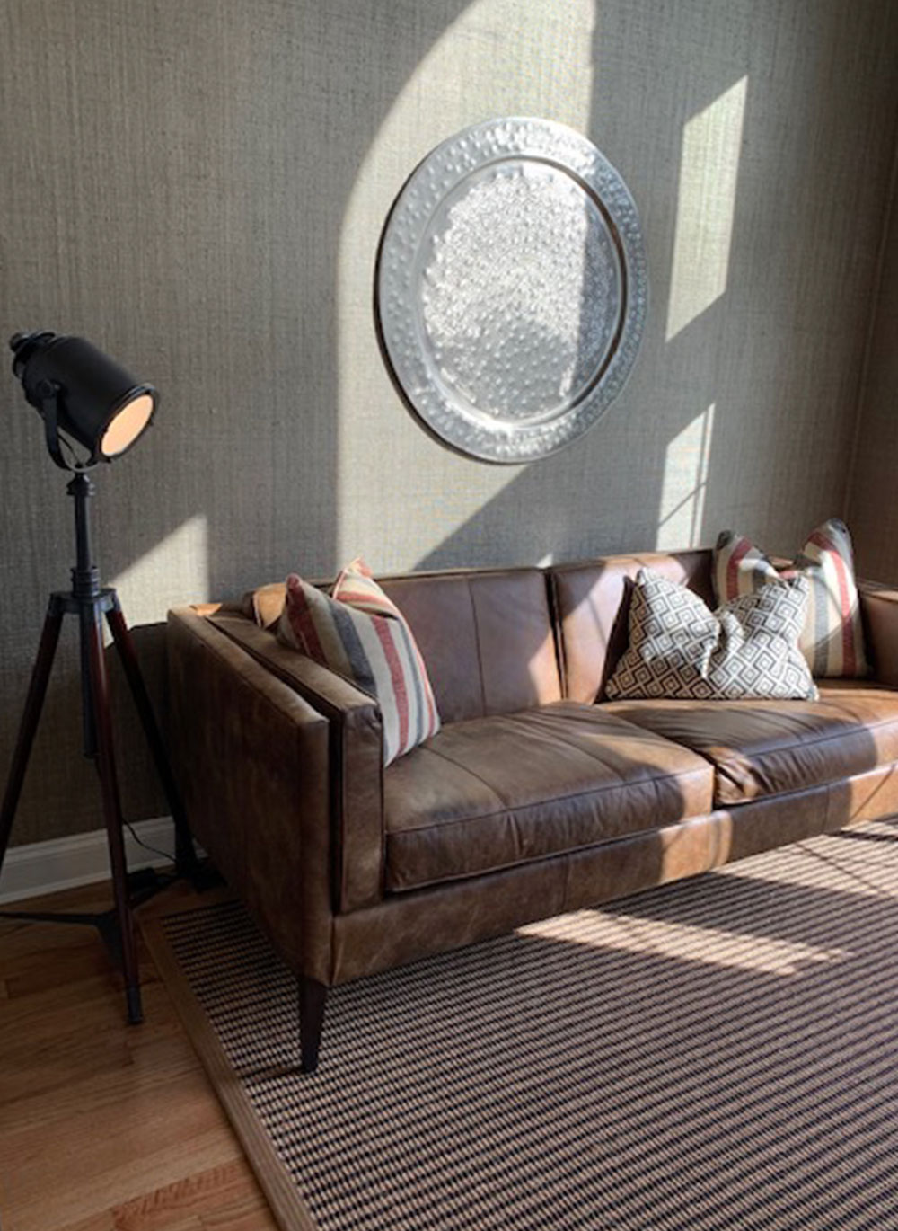 leather couch with patterned pillows