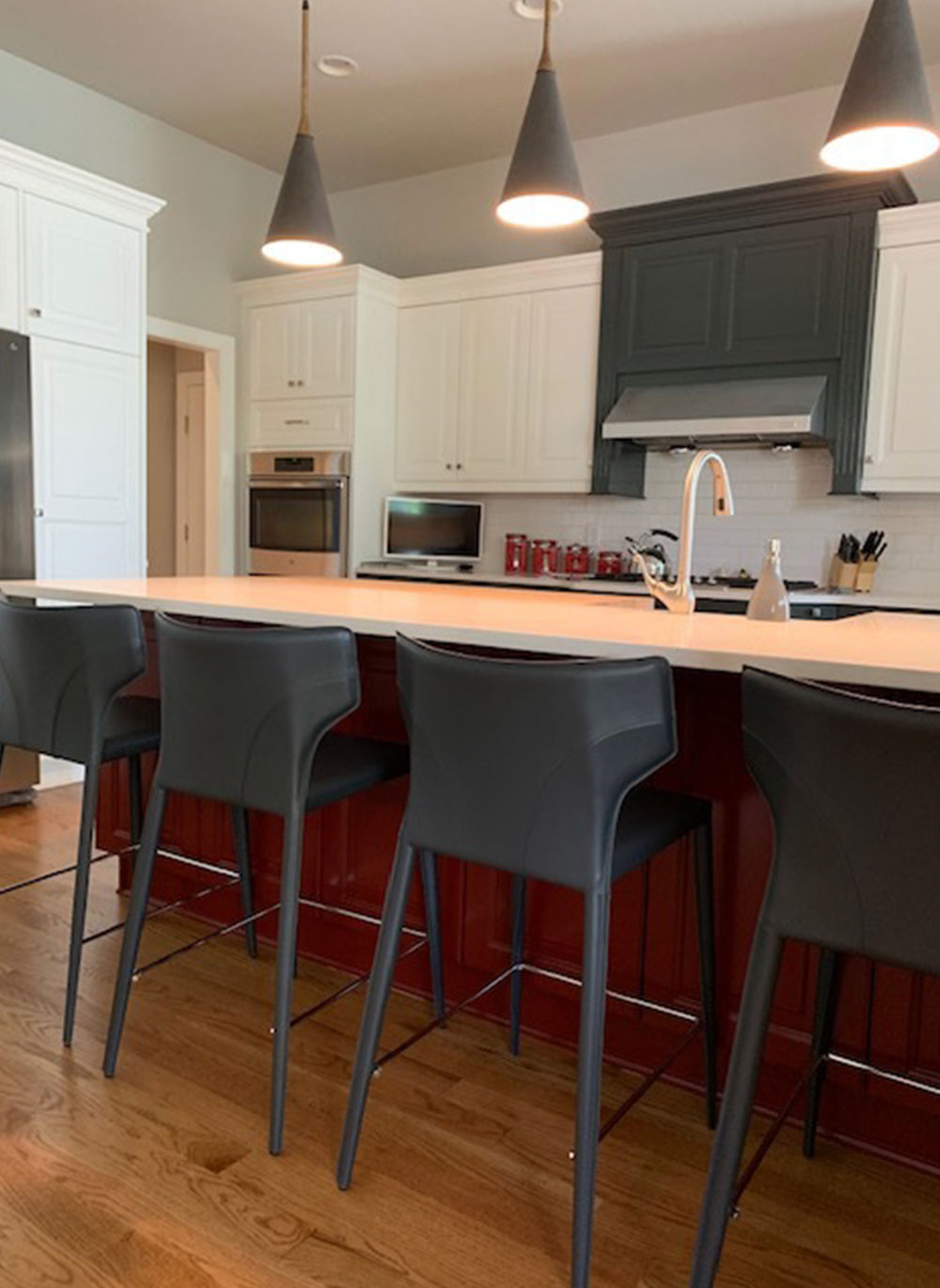 kitchen with large island and modern bar stools