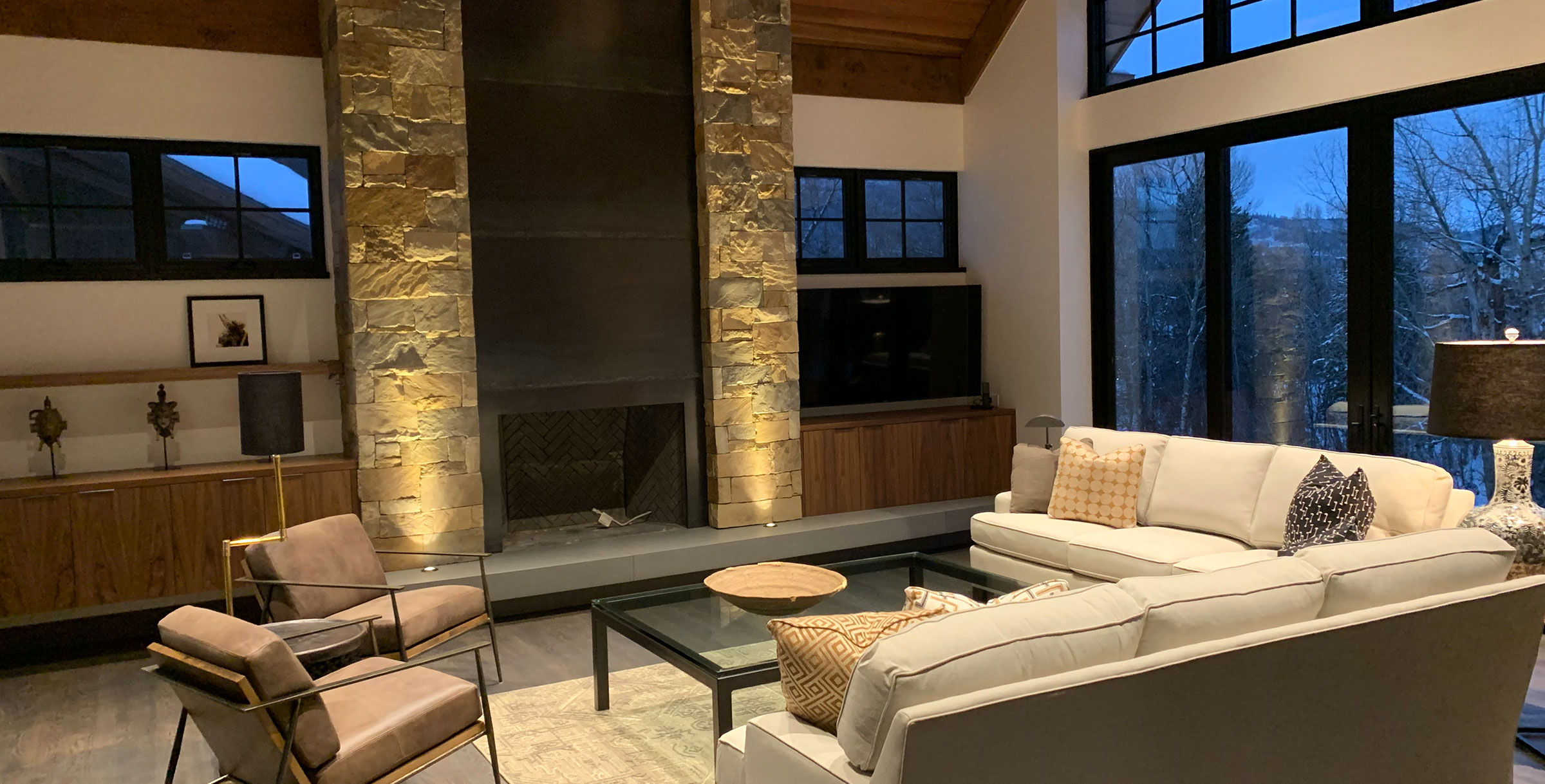 Modern living room with striking black fireplace