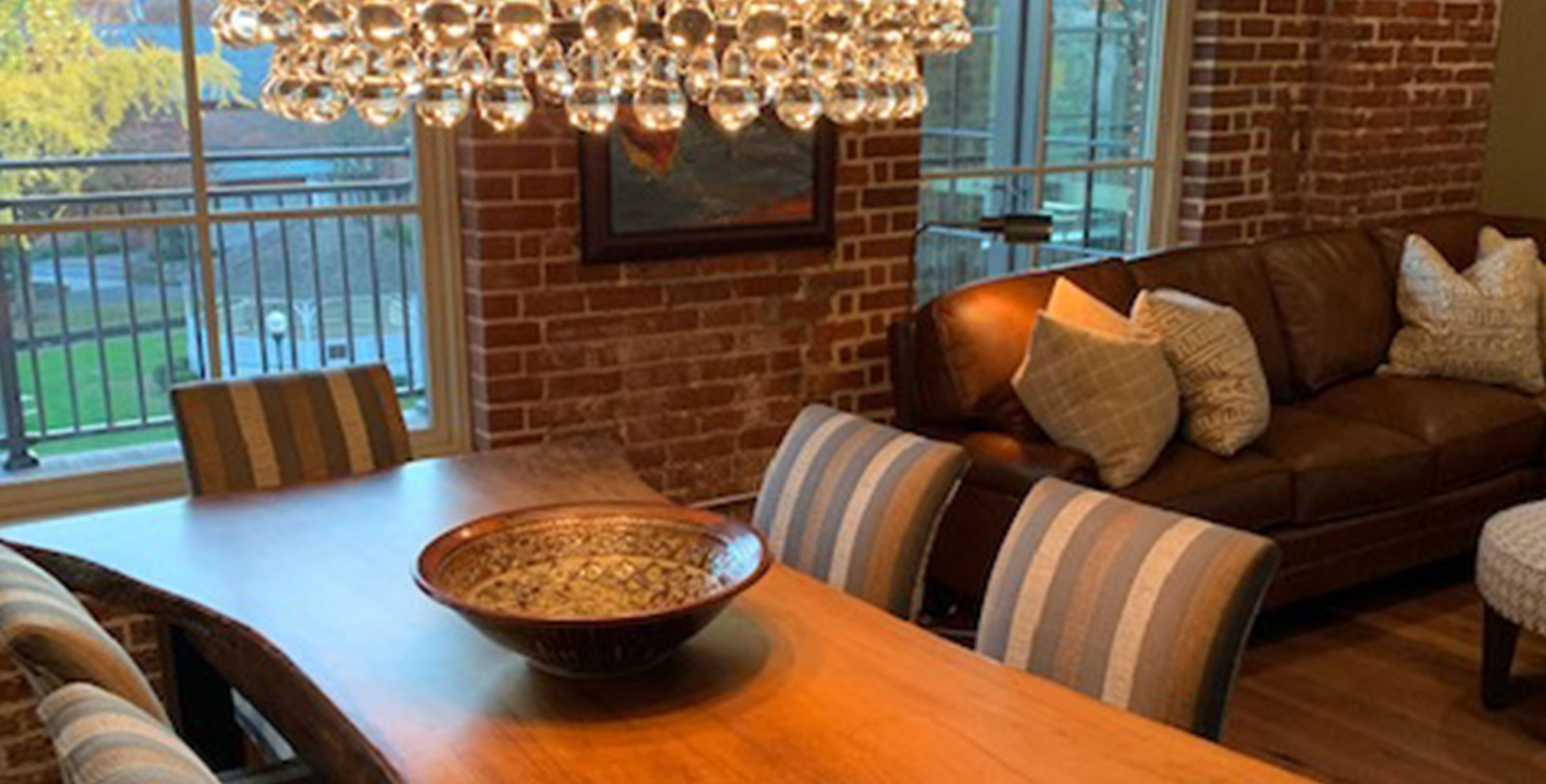 chandelier over custom crafted wood dining room table